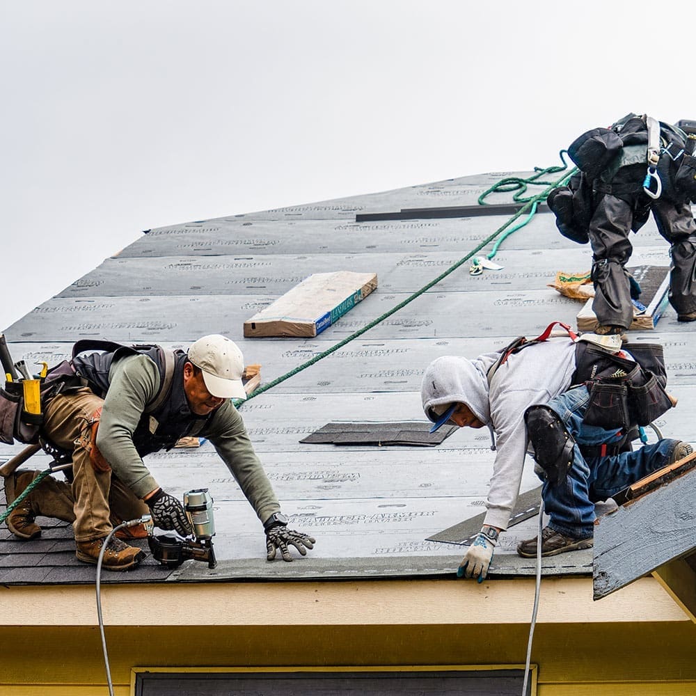 Wayne Craft contractors working on a residential awning in Metro Detroit.